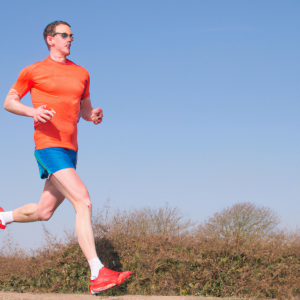 a professional appealing image of a caucasian man or woman jogging on a sunny day