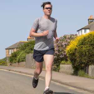 a professional appealing image of a caucasian man or woman jogging on a sunny day 355 300x300