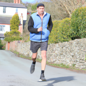 a professional appealing image of a caucasian man or woman jogging on a sunny day 692 300x300