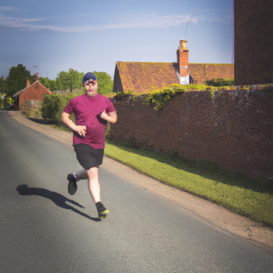 a professional appealing image of a caucasian man or woman jogging on a sunny day