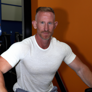 a professional appealing good looking and atheletic image of a caucasian man exercising in a gym