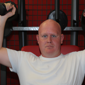 a professional appealing good looking and atheletic image of a caucasian man exercising in a gym 695 300x300