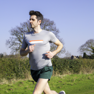 a professional appealing image of a caucasian man or woman jogging on a sunny day